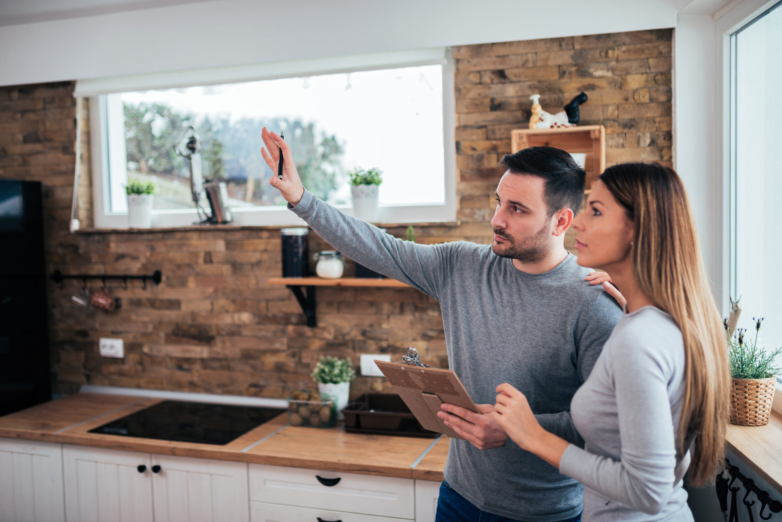 A couple discusses home improvements they could make with a home equity loan.