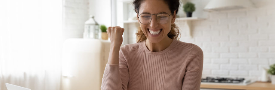 A happy woman sees she got a great rate on her HELOC.