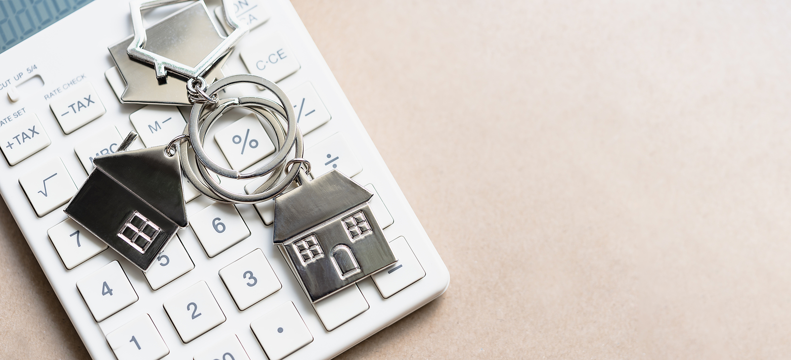 keys to a new home on a calculator