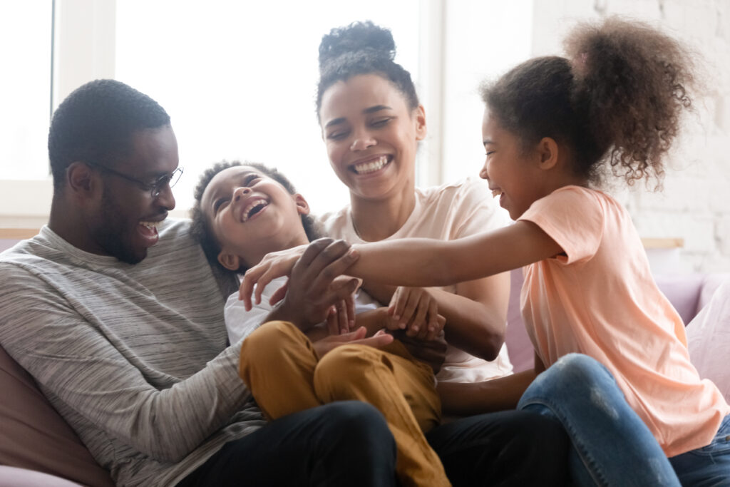 A happy family feels secure after investing in a CD account.