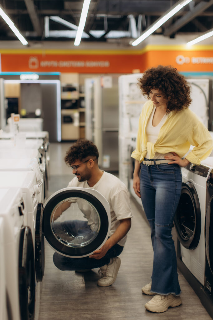 Couple shopping for appliances.